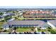 Aerial view of condo community with canals, boat docks, parking, and beautiful surrounding homes at 4000 Bal Harbor Blvd # 124, Punta Gorda, FL 33950