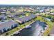 Scenic aerial view of condos with boat docks, a pool and lush landscaping near the water at 4000 Bal Harbor Blvd # 124, Punta Gorda, FL 33950