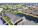 Aerial view of a condo building with boat docks and parking in a beautiful waterfront community at 4000 Bal Harbor Blvd # 124, Punta Gorda, FL 33950