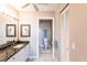 Bright bathroom features a granite countertop vanity and a separate toilet room for added privacy at 4000 Bal Harbor Blvd # 124, Punta Gorda, FL 33950
