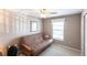 Neutral bedroom features a ceiling fan and a window with an outdoor view at 4000 Bal Harbor Blvd # 124, Punta Gorda, FL 33950