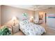 Bright bedroom with neutral decor, wicker accents and an en-suite bathroom at 4000 Bal Harbor Blvd # 124, Punta Gorda, FL 33950