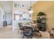 Cozy dining area adjacent to an open kitchen, featuring a round glass table and wicker chairs at 4000 Bal Harbor Blvd # 124, Punta Gorda, FL 33950