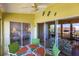 Enclosed lanai features a patio table and overlooks a living room and bedroom at 4000 Bal Harbor Blvd # 124, Punta Gorda, FL 33950