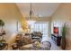 Comfortable living room with sliding glass doors to a balcony and a dining area at 4000 Bal Harbor Blvd # 124, Punta Gorda, FL 33950