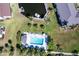 Aerial view of the community pool and boat dock with beautiful landscaping and waterfront access at 4000 Bal Harbor Blvd # 124, Punta Gorda, FL 33950