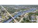 Aerial view of a waterfront community with canals and lush greenery at 4010 Yucatan Cir, Port Charlotte, FL 33948