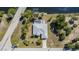 Aerial view showcasing a property, pool, waterfront canal access and neighborhood at 4010 Yucatan Cir, Port Charlotte, FL 33948