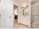 Well-lit bathroom features a single sink vanity and a tiled walk-in shower at 4010 Yucatan Cir, Port Charlotte, FL 33948