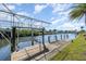This canal-front home includes a dock and boat lift for easy access to the water at 4010 Yucatan Cir, Port Charlotte, FL 33948