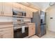 Modern kitchen features stainless steel appliances, ample cabinets, and stylish design at 4010 Yucatan Cir, Port Charlotte, FL 33948