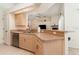 Kitchen with breakfast bar and stainless steel dishwasher at 4010 Yucatan Cir, Port Charlotte, FL 33948