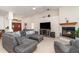 Spacious living room featuring a cozy fireplace, comfortable seating, and natural lighting at 4010 Yucatan Cir, Port Charlotte, FL 33948