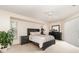 Relaxing bedroom featuring a ceiling fan and large window at 4010 Yucatan Cir, Port Charlotte, FL 33948