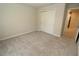 Comfortable bedroom with carpet and a closet, complemented by a view into the hall at 4071 Conestoga St, Port Charlotte, FL 33948