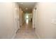 Bright hallway with neutral walls, tile flooring, and recessed lighting at 4071 Conestoga St, Port Charlotte, FL 33948