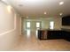 Open concept kitchen with dark cabinets, granite countertops, and stainless steel appliances at 4071 Conestoga St, Port Charlotte, FL 33948
