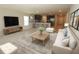 Bright living area featuring an open layout with an adjacent kitchen and natural light, great for modern living at 4071 Conestoga St, Port Charlotte, FL 33948