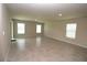 Spacious living room with tile flooring, recessed lighting, and large windows at 4071 Conestoga St, Port Charlotte, FL 33948