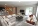 Spacious living room with tile floors and an open plan, perfect for relaxation and entertaining at 4071 Conestoga St, Port Charlotte, FL 33948