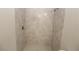 Close-up of a tile shower featuring neutral tones and updated fixtures at 4071 Conestoga St, Port Charlotte, FL 33948