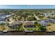 Expansive aerial view of waterfront homes boasting lush landscaping and private docks on a sunny day at 4174 Perch Cir, Port Charlotte, FL 33948