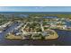 Beautiful waterfront property with boat dock and lush landscaping in a serene neighborhood setting at 4174 Perch Cir, Port Charlotte, FL 33948