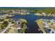 High-angle of a home with a private dock, screened lanai, and direct access to expansive waterways at 4174 Perch Cir, Port Charlotte, FL 33948