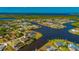 Vast aerial view of waterfront residences with access to waterways, landscaping, and community layout at 4174 Perch Cir, Port Charlotte, FL 33948