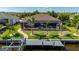 Waterfront home with screened lanai, pool, and dock access, perfect for enjoying outdoor living at 4174 Perch Cir, Port Charlotte, FL 33948