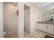 Bright bathroom featuring white cabinetry, granite counters, and tiled flooring at 4174 Perch Cir, Port Charlotte, FL 33948