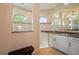Bright bathroom featuring white cabinetry, granite counters, and a tiled walk-in shower with natural light at 4174 Perch Cir, Port Charlotte, FL 33948