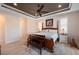 Bedroom with a four-poster bed, ceiling fan, and neutral decor with lots of natural light at 4174 Perch Cir, Port Charlotte, FL 33948
