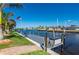The backyard offers a serene setting with a private dock, perfect for boating and enjoying the waterfront at 4174 Perch Cir, Port Charlotte, FL 33948