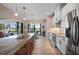 Modern kitchen with stainless steel appliances, island sink, and sliding glass doors leading to the pool area at 4174 Perch Cir, Port Charlotte, FL 33948