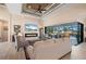 Bright living room features a fireplace, large TV, and a sliding glass door with a pool view at 4174 Perch Cir, Port Charlotte, FL 33948