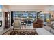 Comfortable living room with water view and access to the screened outdoor area at 4174 Perch Cir, Port Charlotte, FL 33948