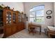 Comfortable office space featuring a desk, chair, and large window offering natural light at 4174 Perch Cir, Port Charlotte, FL 33948