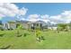 A spacious backyard features a screened-in lanai and lush landscaping at 4463 Cromey Rd, North Port, FL 34288