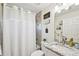 Bright bathroom with shower, decorative wall hangings, and granite countertop vanity at 4463 Cromey Rd, North Port, FL 34288