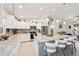 Stylish kitchen featuring granite countertops, stainless steel appliances, ample cabinet space, and island seating at 4463 Cromey Rd, North Port, FL 34288