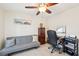 A cozy office space with an adjustable desk, and natural light at 4463 Cromey Rd, North Port, FL 34288