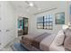 Bedroom with sliding glass door to an outdoor living space at 4676 Tuscana Dr, Sarasota, FL 34241