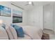 Cozy bedroom features a plush bed, soft pillows and a bright window at 4676 Tuscana Dr, Sarasota, FL 34241