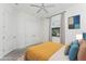 Bright bedroom with plush bed, closet, and large window at 4676 Tuscana Dr, Sarasota, FL 34241
