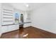 Bright bedroom features custom built-ins, a desk and arched windows offering lots of natural light at 4676 Tuscana Dr, Sarasota, FL 34241