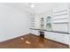 Bright bedroom features custom built-ins, a desk and arched windows offering lots of natural light at 4676 Tuscana Dr, Sarasota, FL 34241
