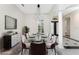 Formal dining room with a modern chandelier, decor, and elegant finishes at 4676 Tuscana Dr, Sarasota, FL 34241