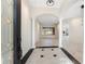 Inviting foyer with high ceilings, decorative columns and tile flooring at 4676 Tuscana Dr, Sarasota, FL 34241