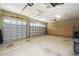 Spacious three-car garage featuring ample storage cabinets and plenty of room for vehicles and projects at 4676 Tuscana Dr, Sarasota, FL 34241
